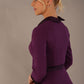 Side view of the Sybil satin contrast dress, highlighting the A-line skirt and 3/4 satin-cuffed sleeves. (Imperial Purple)
