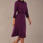 Model walking in the Sybil dress, showing the fluid movement of the A-line midi skirt (Imperial Purple)