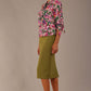 Model wearing a Radley Floral Tango print top with a central tie neckline and 3/4 sleeves, styled with an olive green skirt.