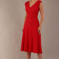 Woman wearing the Ayesha lace A-line midi dress in vibrant passion red against a neutral background (Passion Red)