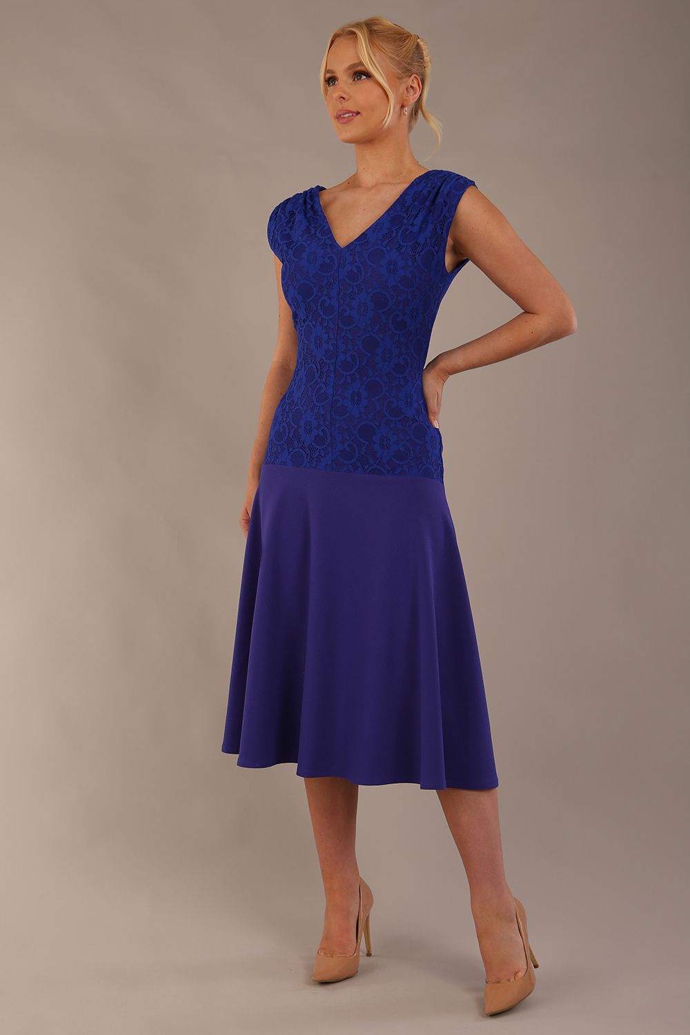 Model wearing the Ayesha lace bodice A-line dress in spectrum indigo. (Spectrum Indigo)