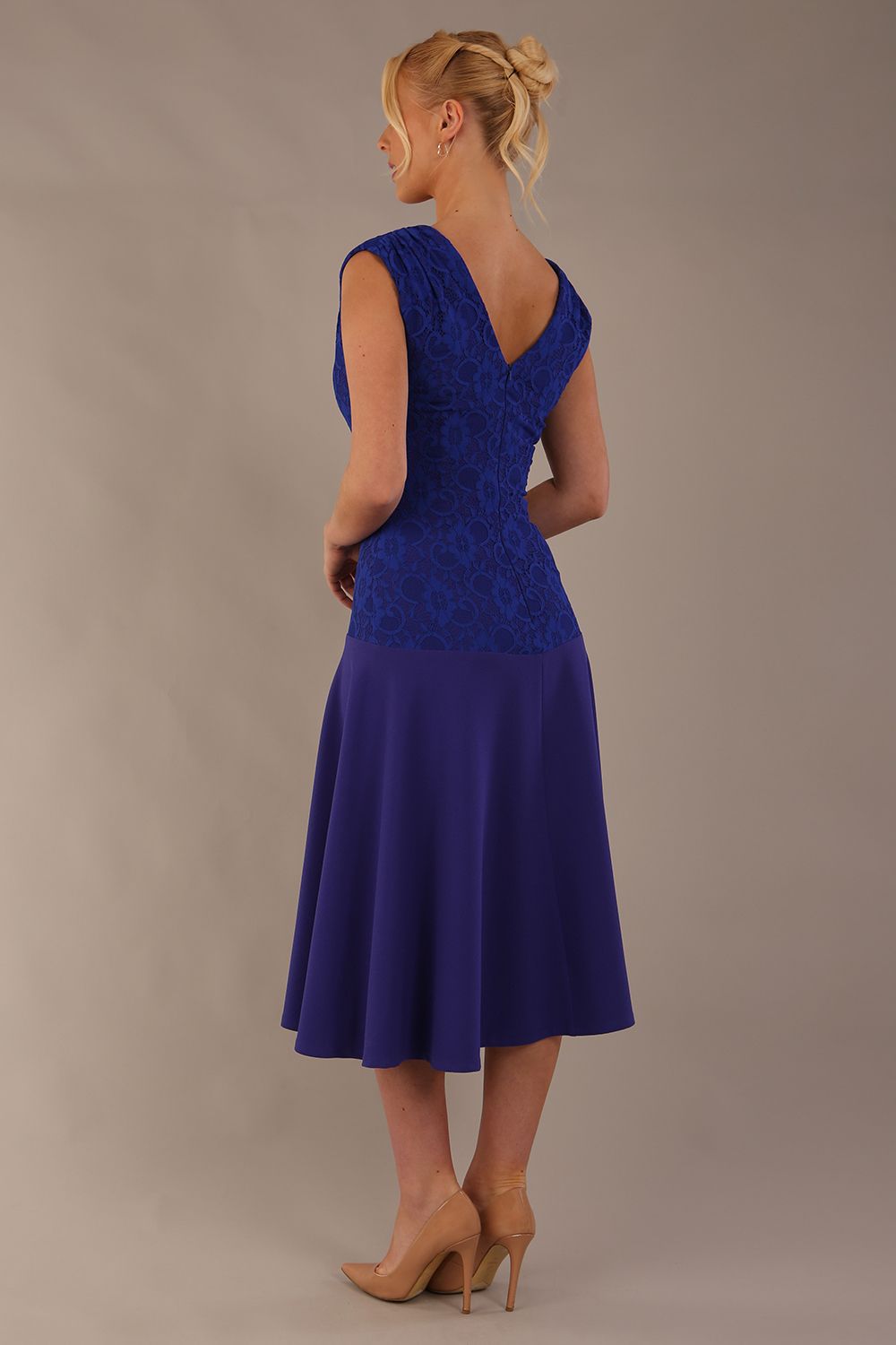 Back view of the Ayesha dress in spectrum indigo, showing the deep V-back and A-line skirt. (Spectrum Indigo)