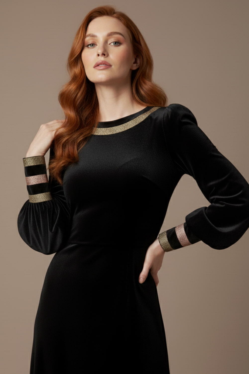 Woman wearing a black dress with gold accents on a beige background (Black Velvet with Sherwood Glitter Contrast)