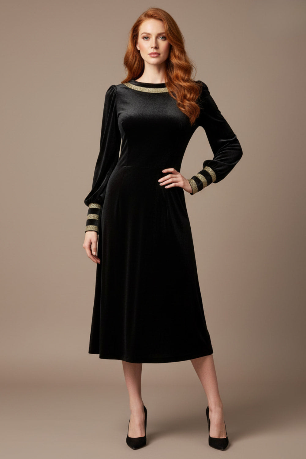 Woman wearing a black dress with long sleeves on a beige background  (Black Velvet with Sherwood Glitter Contrast)