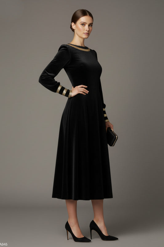 Model wearing the diva catwalk Spinetti long-sleeved jewelled velvet midi dress in black.