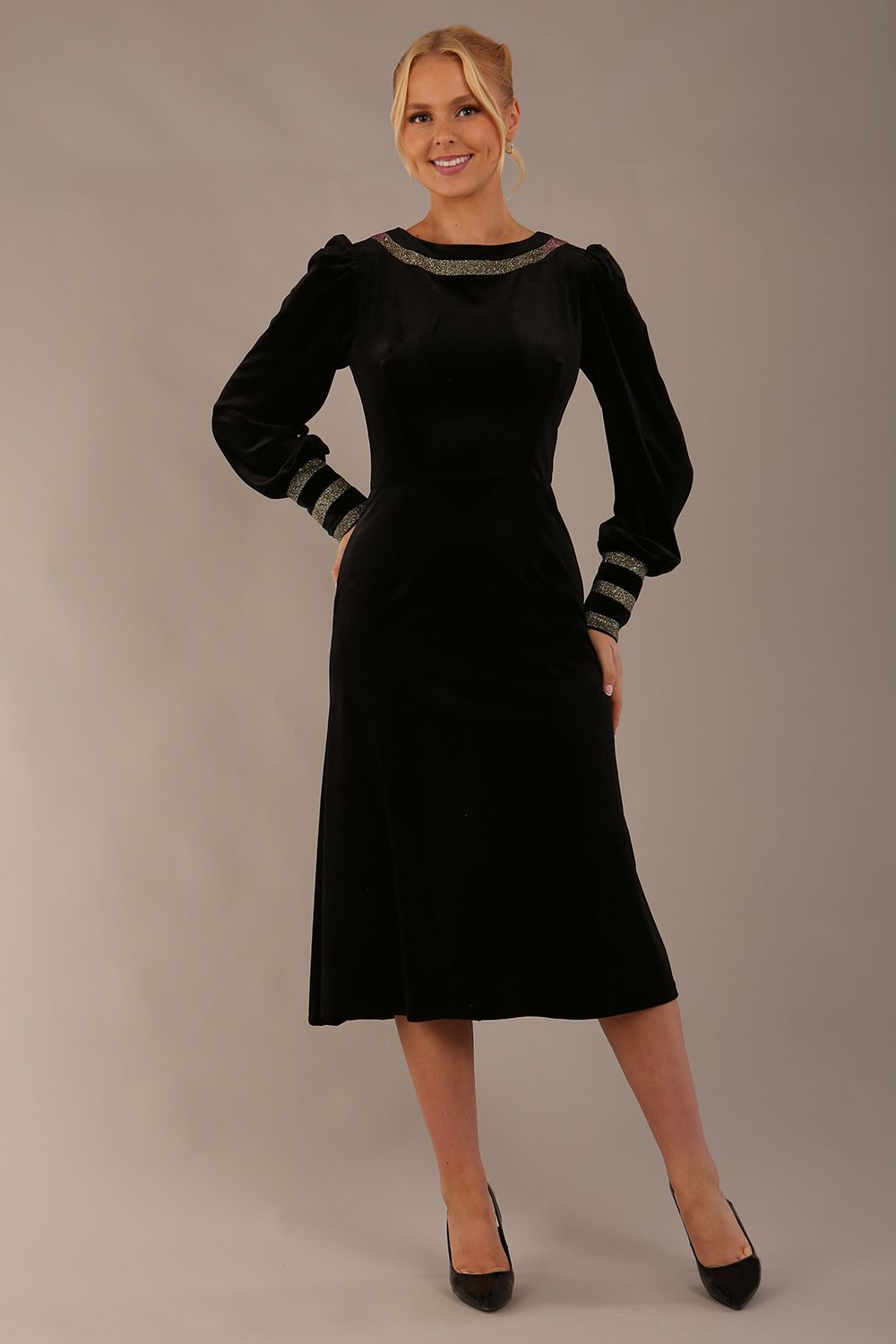 Model wearing the diva catwalk Spinetti long-sleeved jewelled velvet midi dress in black (Black Velvet with Sherwood Glitter Contrast)