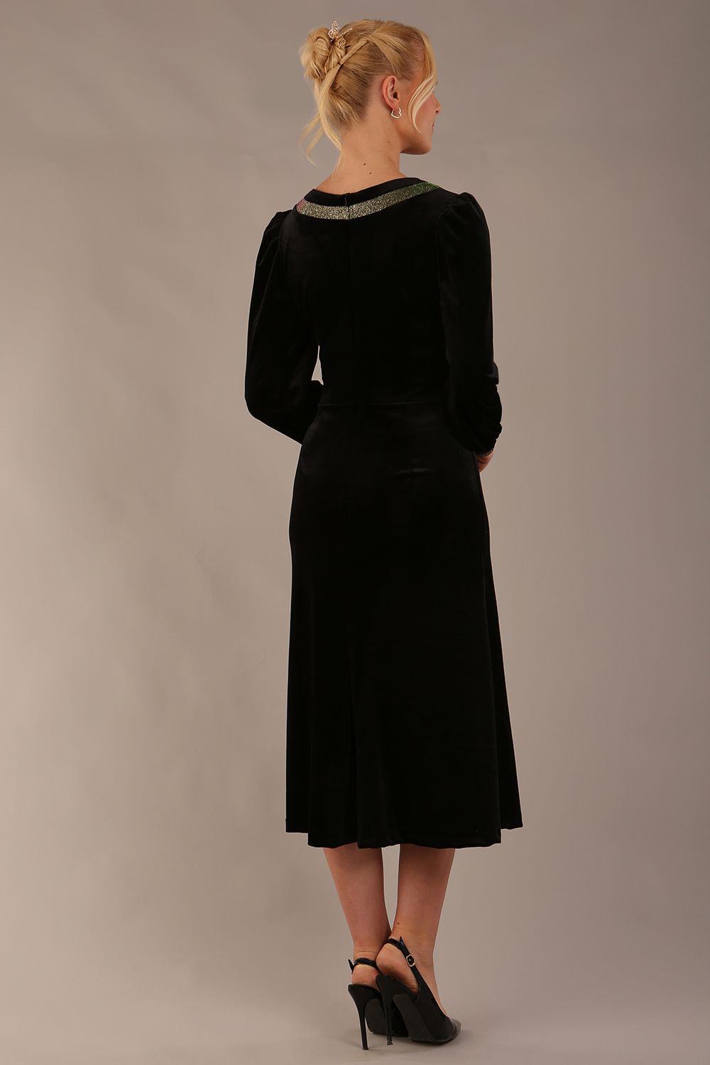 Model wearing the diva catwalk Spinetti long-sleeved jewelled velvet midi dress in black (Black Velvet with Sherwood Glitter Contrast)