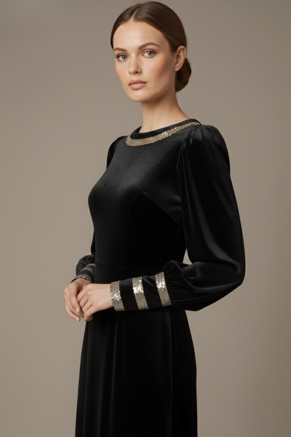 Model wearing the diva catwalk Spinetti long-sleeved jewelled velvet midi dress in black side close up