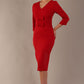 Model wearing the Corniche double bow pencil dress in dark red (Dark Red)