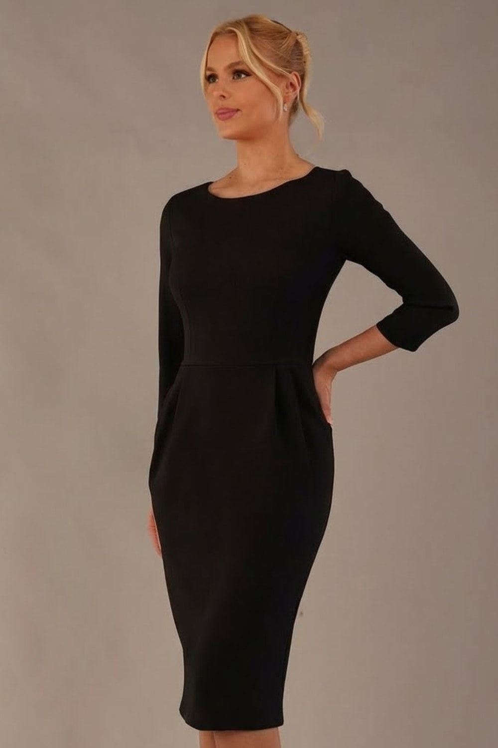 Model wearing the Makepiece tulip skirt tailored dress in black, featuring an elegant boat neckline (Black)
