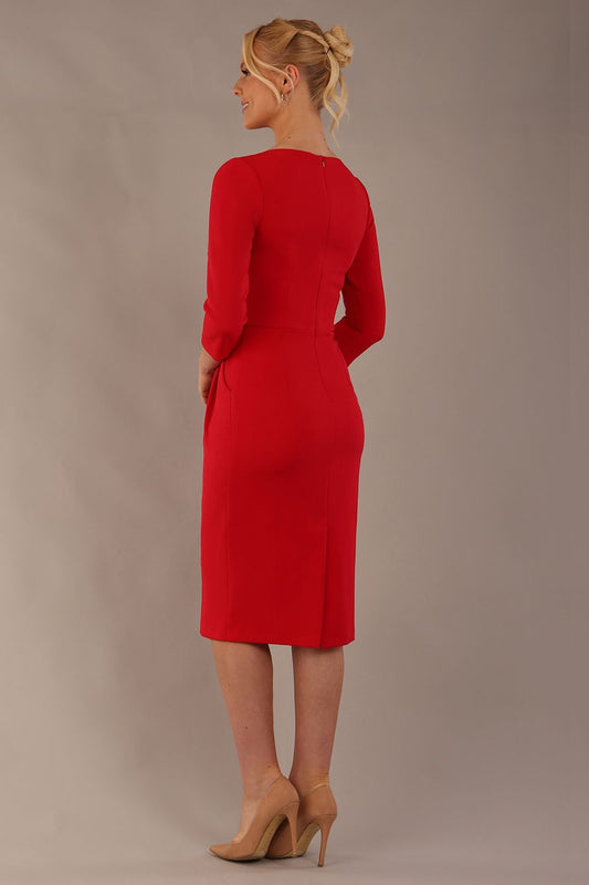 back view of the Model wearing the Makepiece tulip skirt tailored dress in scarlet red, featuring an elegant boat neckline (Scarlet Red)