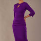 Model wearing the diva catwalk Yasmeen pencil dress in passion purple, featuring a teardrop keyhole neckline (Passion Purple)