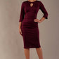 Model wearing the diva catwalk Yasmeen pencil dress in burgundy, featuring a teardrop keyhole neckline (Blissful Burgundy)