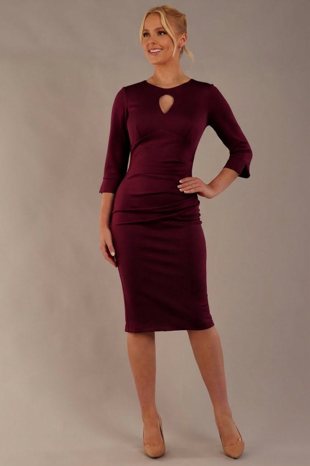 Model wearing the diva catwalk Yasmeen pencil dress in burgundy, featuring a teardrop keyhole neckline (Blissful Burgundy)