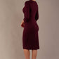 Back view of the diva catwalk Yasmeen bi-stretch dress, showing the clean tailored lines and back vent (Blissful Burgundy)