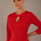 Model wearing the diva catwalk Yasmeen pencil dress in electric red, featuring a teardrop keyhole neckline. Close-up of the keyhole neckline and ruched bodice on the Yasmeen dress in electric red (Electric Red)