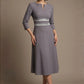model wearing the Seed Alisa dress, showcasing the sharp V-notch neckline, flawless tailoring, and luxurious satin contrast detail (Sky Grey - Silver Grey)