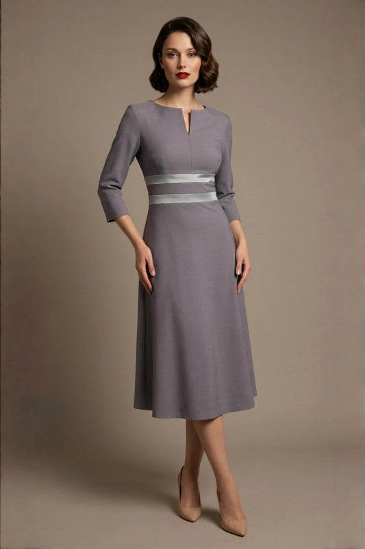 model wearing the Seed Alisa dress, showcasing the sharp V-notch neckline, flawless tailoring, and luxurious satin contrast detail (Sky Grey - Silver Grey)