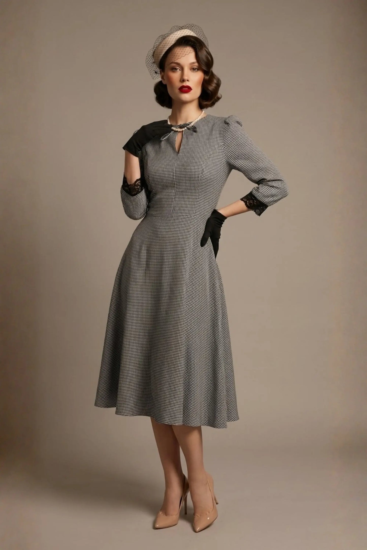 Woman wearing a diva catwalk Alanna Dogtooth Tie-Detail A-Line Dress | Diva Catwalk with long sleeves against a plain background (Petite Dogtooth Check)