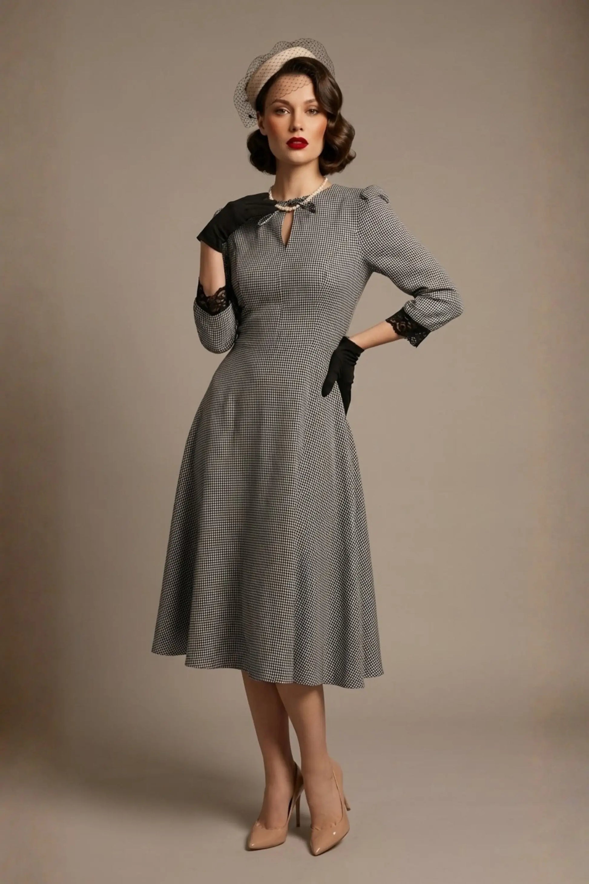 Woman wearing a diva catwalk Alanna Dogtooth Tie-Detail A-Line Dress | Diva Catwalk with long sleeves against a plain background (Petite Dogtooth Check)
