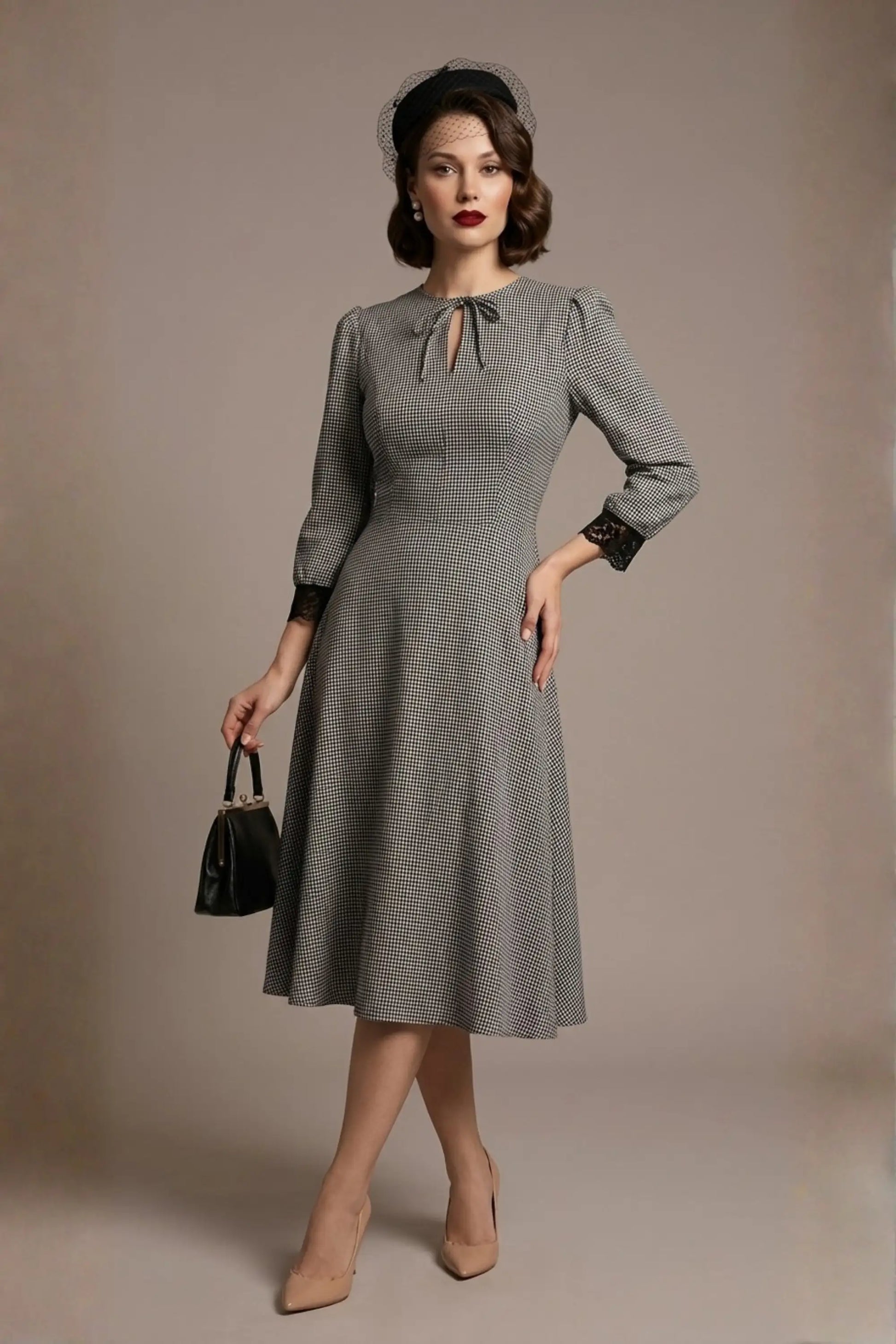 Woman wearing a diva catwalk Alanna Dogtooth Tie-Detail A-Line Dress | Diva Catwalk with long sleeves against a plain background (Petite Dogtooth Check)