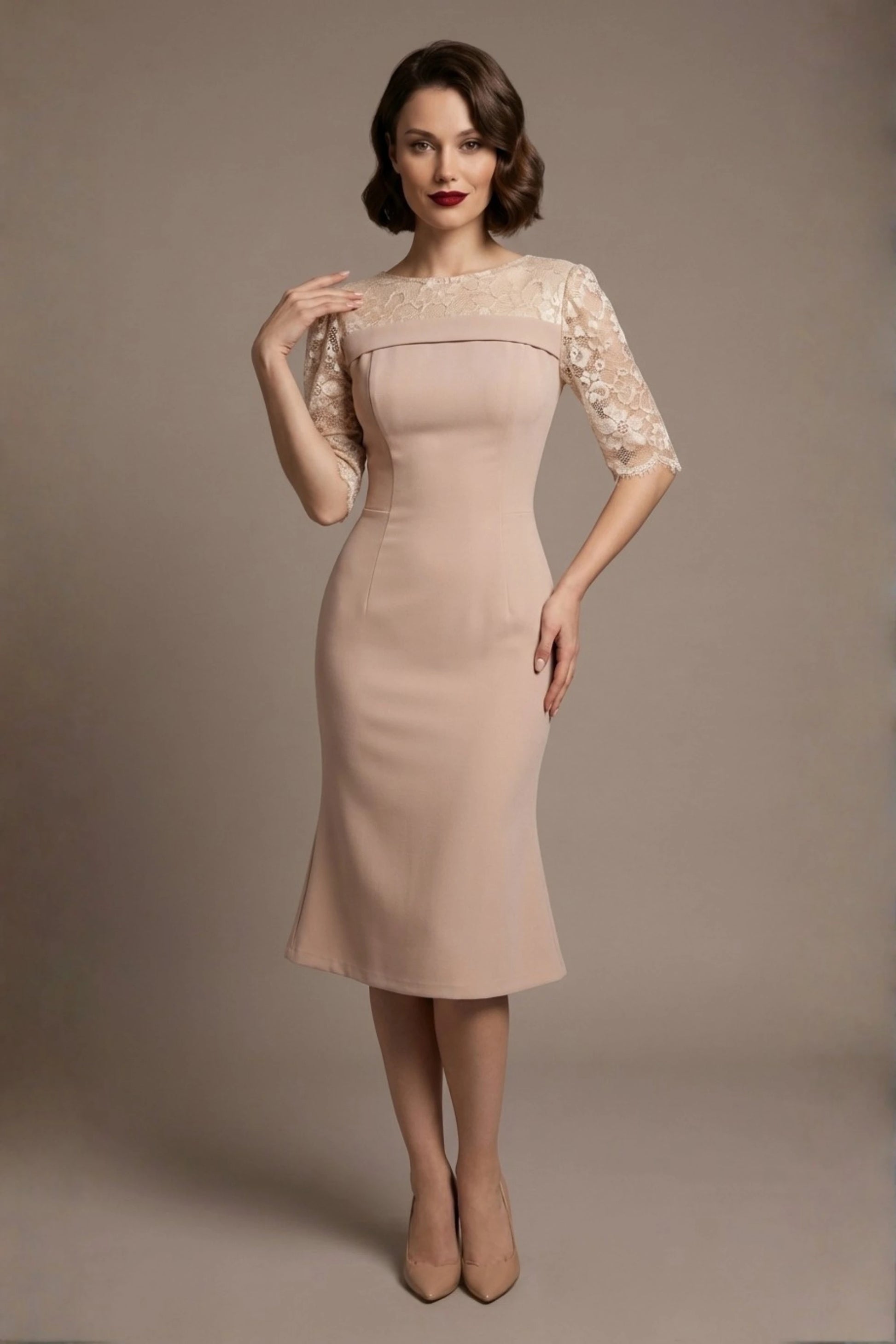 Woman wearing a diva catwalk Francesca Lace Fluted Dress in pink haze colour dress with lace sleeves against a brown background (Pink Haze)