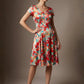 Woman wearing a diva catwalk colorful floral dress called Valia Silk Touch A-Line Dress against a plain background (Floral Dream Print)