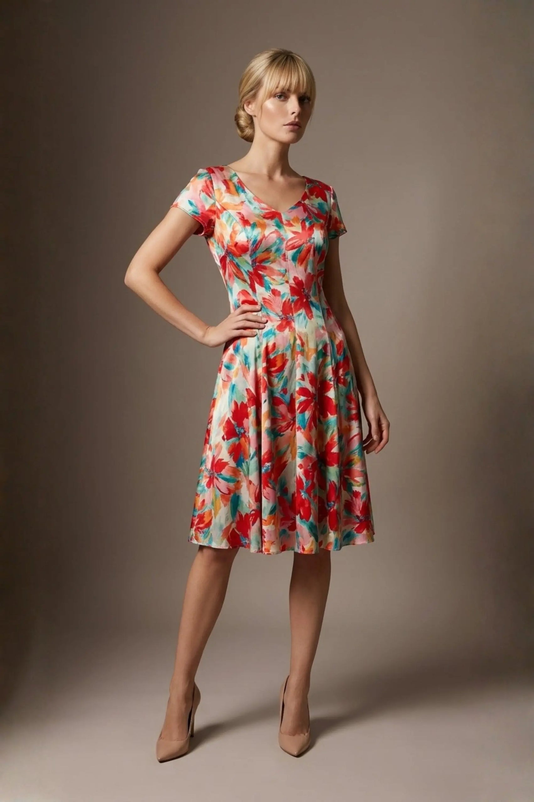 Woman wearing a diva catwalk colorful floral dress called Valia Silk Touch A-Line Dress against a plain background (Floral Dream Print)