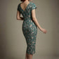 Woman wearing a diva catwalk Magritte Vintage Floral Cotton Pencil Dress, floral dress against a plain background (Vintage Floral Print)
