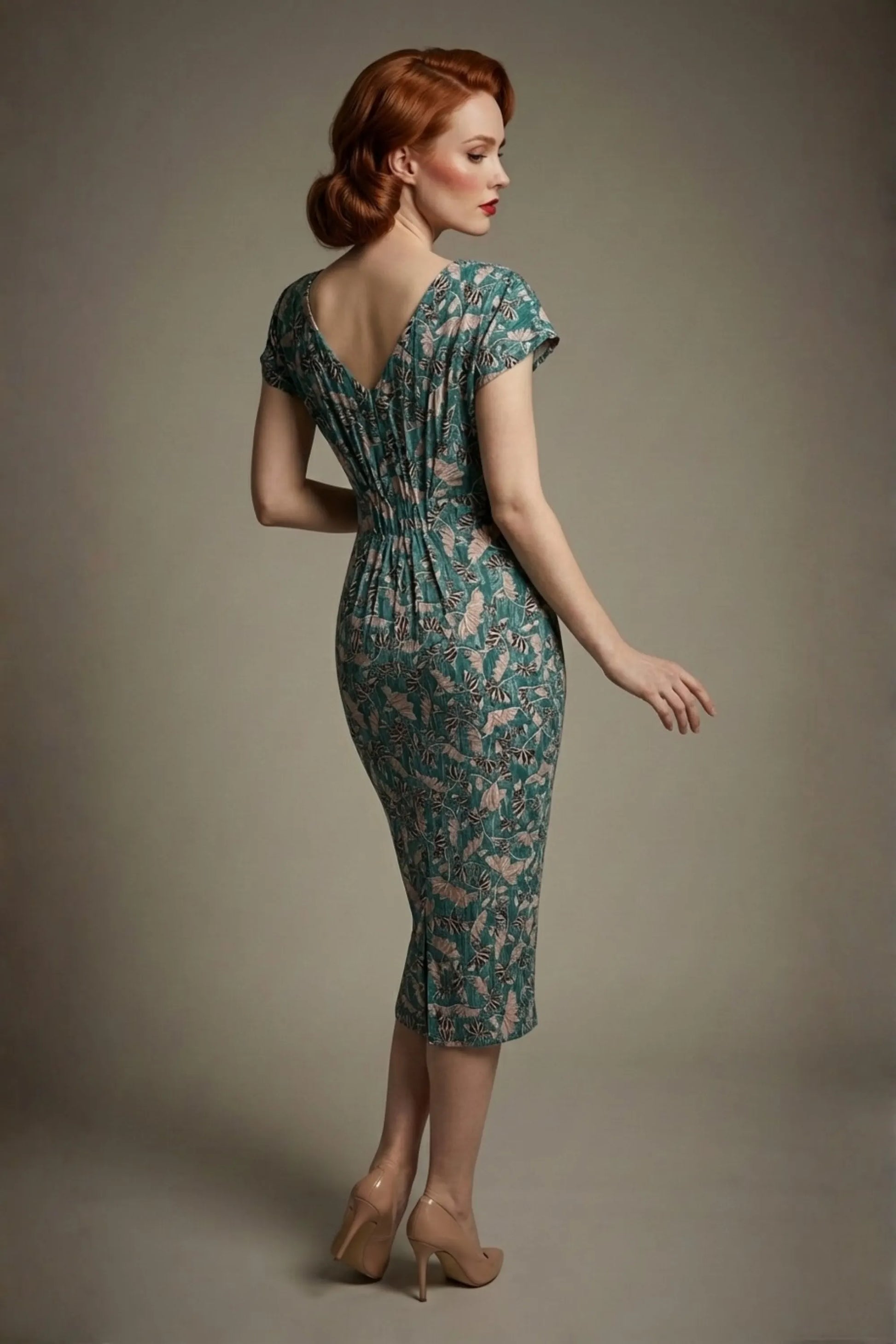 Woman wearing a diva catwalk Magritte Vintage Floral Cotton Pencil Dress, floral dress against a plain background (Vintage Floral Print)
