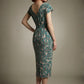 Woman wearing a diva catwalk Magritte Vintage Floral Cotton Pencil Dress, floral dress against a plain background (Vintage Floral Print)