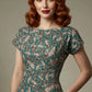 Woman wearing a diva catwalk Magritte Vintage Floral Cotton Pencil Dress, floral dress against a plain background (Vintage Floral Print)
