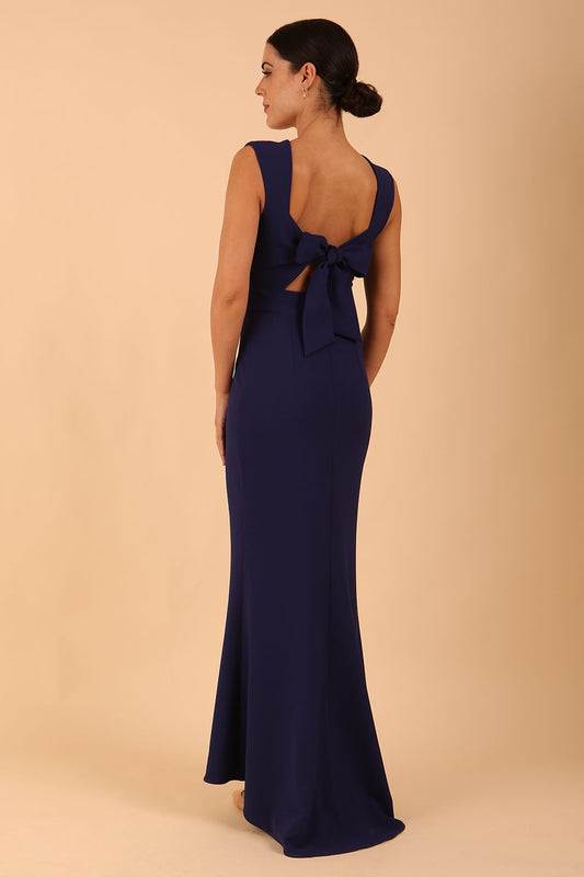 model wearing a diva catwalk Morwenna Keyhole Full Length Dress in navy blue colour