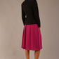 back view of the Model wearing the Melberry tailored jacket in black, showing the sculpted waist and statement lapel detail.