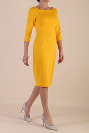 Model wearing diva catwalk Kinga 3/4 Sleeve pencil skirt dress yellow