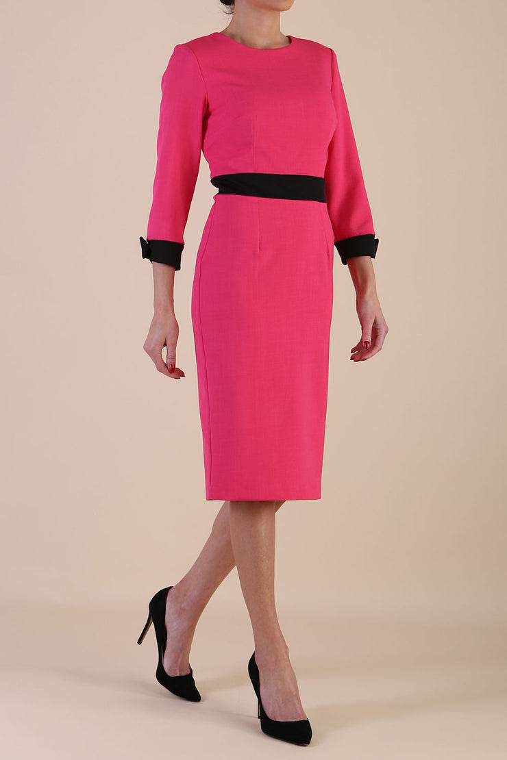 Model wearing diva catwalk Reese 3/4 Sleeved pencil skirt dress with a contrast sleeve and waistband details in Fuschia Pink/Black