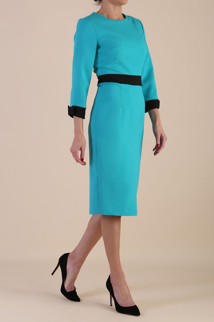 Model wearing diva catwalk Reese 3/4 Sleeved pencil skirt dress with a contrast sleeve and waistband details in Aqua Green/Black