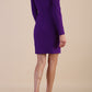 Image of model wearing a long sleeved pleased Mini Pencil Dress from Diva Catwalk in Passion Purple in high heal shoes