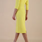 model wearing diva catwalk ubrique pencil dress with a keyhole detail and sleeves in yellow colour