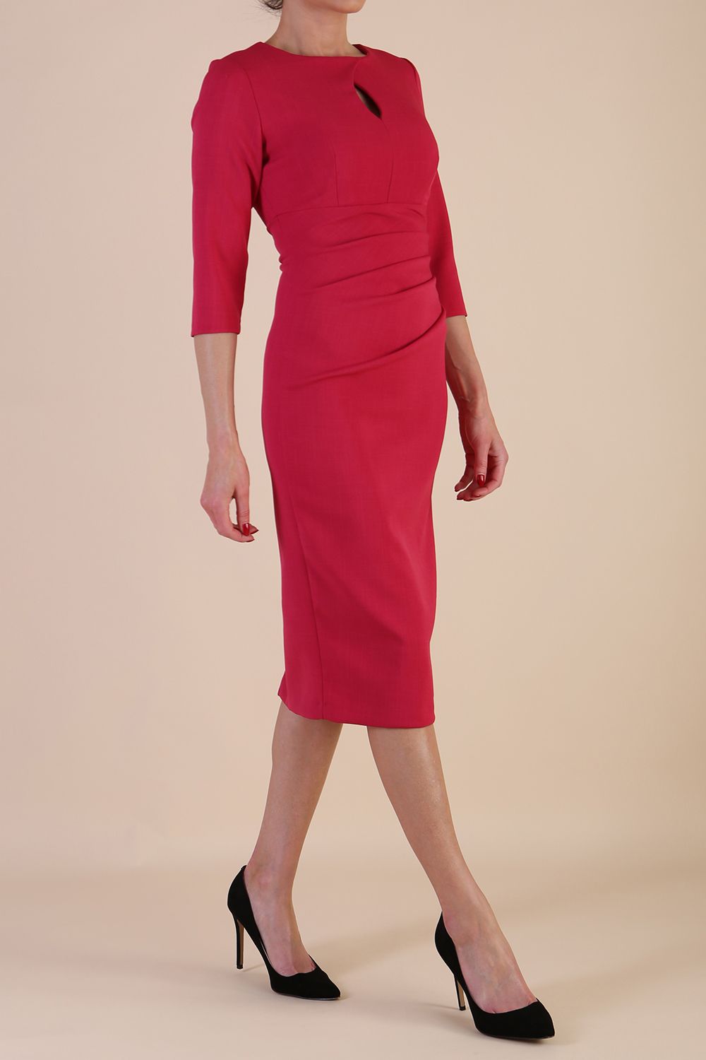 model wearing diva catwalk ubrique pencil dress with a keyhole detail and sleeves in Raspberry Pink