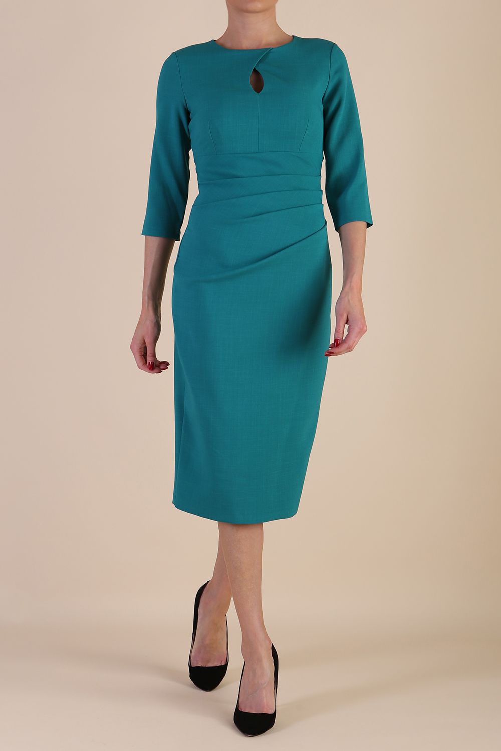 model wearing diva catwalk ubrique pencil dress with a keyhole detail and sleeves in parasailing green