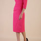 model wearing diva catwalk ubrique pencil dress with a keyhole detail and sleeves in fuchsia pink back