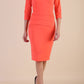 Model wearing Diva catwalk Daphne ¾ Sleeved pencil-skirt dress with pleat detail across the hips and ¾ sleeve length in hot coral front