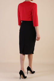brunette model wearing diva catwalk red sleeved bolero over a printed pencil dress front
