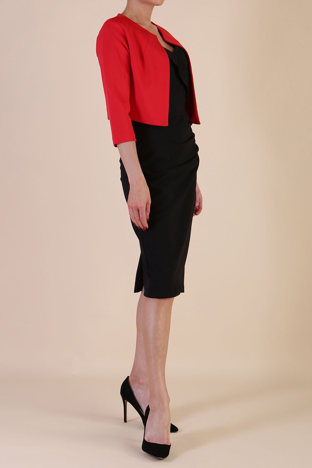 brunette model wearing diva catwalk red sleeved bolero over a printed pencil dress front