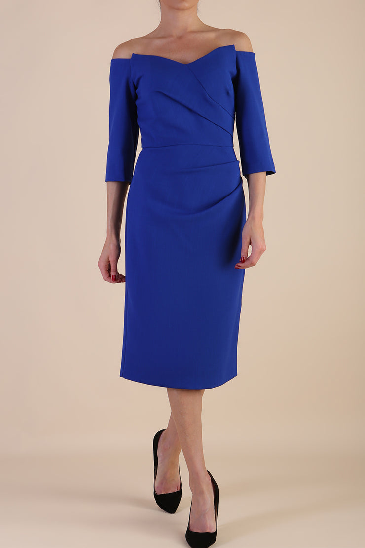 model is wearing diva catwalk lauren odd shoulder asymmetric neckline pencil dress with sleeves in cobalt blue front