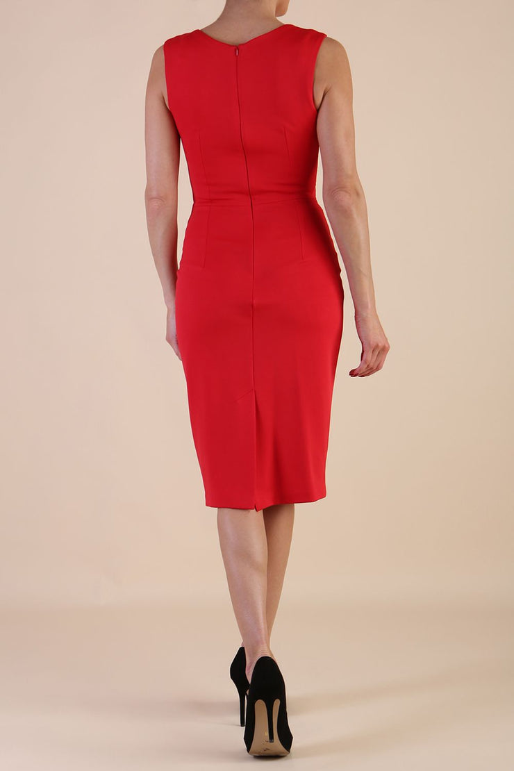  model wearing diva catwalk primula pencil skirt dress in pink with pleating on one side and sleeveless design in colour red