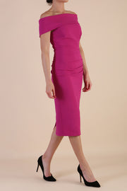 model is wearing diva catwalk amelia pencil dress with bardot neckline and ruched back in Magenta front