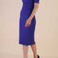 model is wearing Diva Catwalk Lydia Short Sleeve Pencil Dress with pleating across the tummy and split neckline in Deep Orient Blue