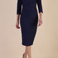 model is wearing diva catwalk seed fitzrovia sleeved pencil dress in navy blue front
